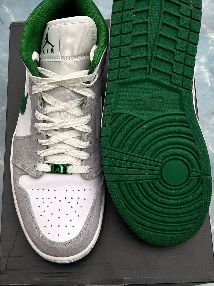 Pre-owned Jordan 1 Mid SE in grey, white, and green with a green outsole.