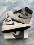 JORDAN 1 RETRO A MA MANIERE, tried on size 7, with white textured leather and burgundy accents.