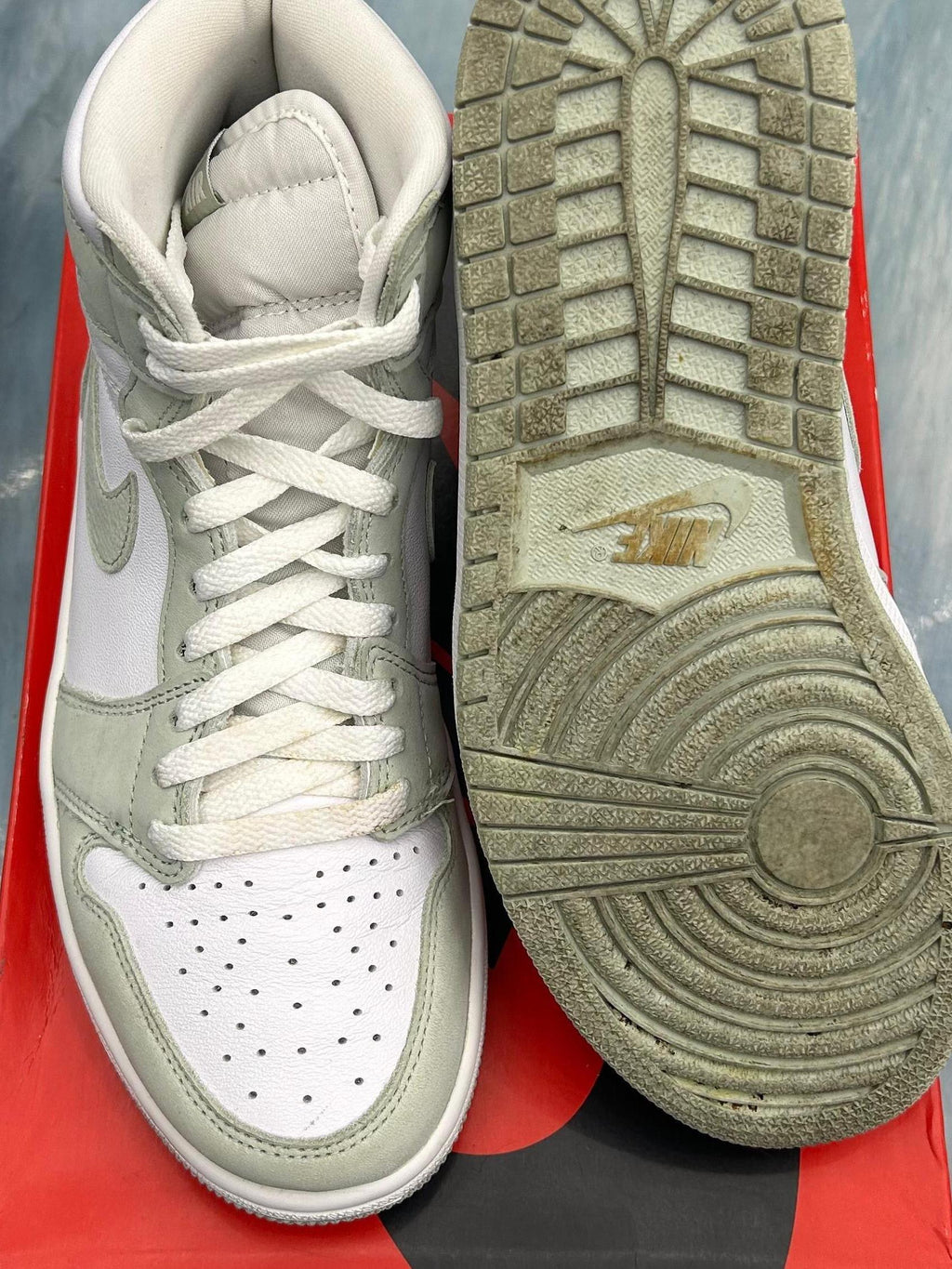Pre-owned Jordan 1 Retro High OG Seafoam (W) sneakers, size 8.5W/7M, showing white and seafoam green leather with a dirty sole.