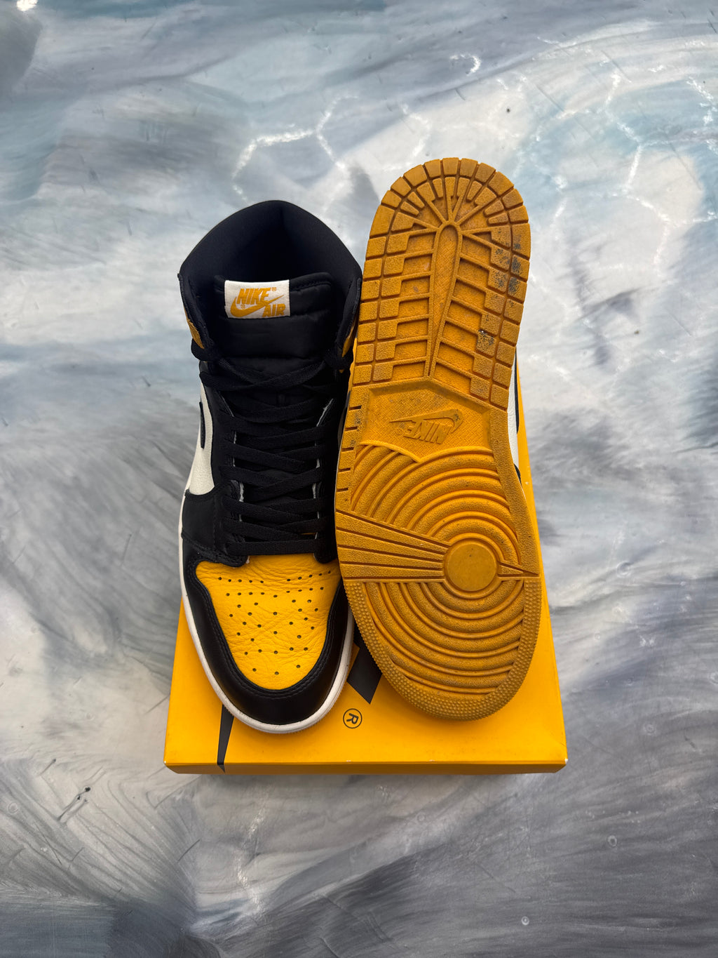Pre-owned Jordan 1 Retro High OG Taxi, black and yellow leather, size 12, with visible sole.