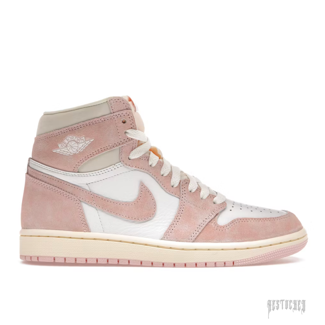 JORDAN 1 RETRO HIGH OG WASHED PINK (WOMENS) sneaker, featuring pink suede and white leather panels.