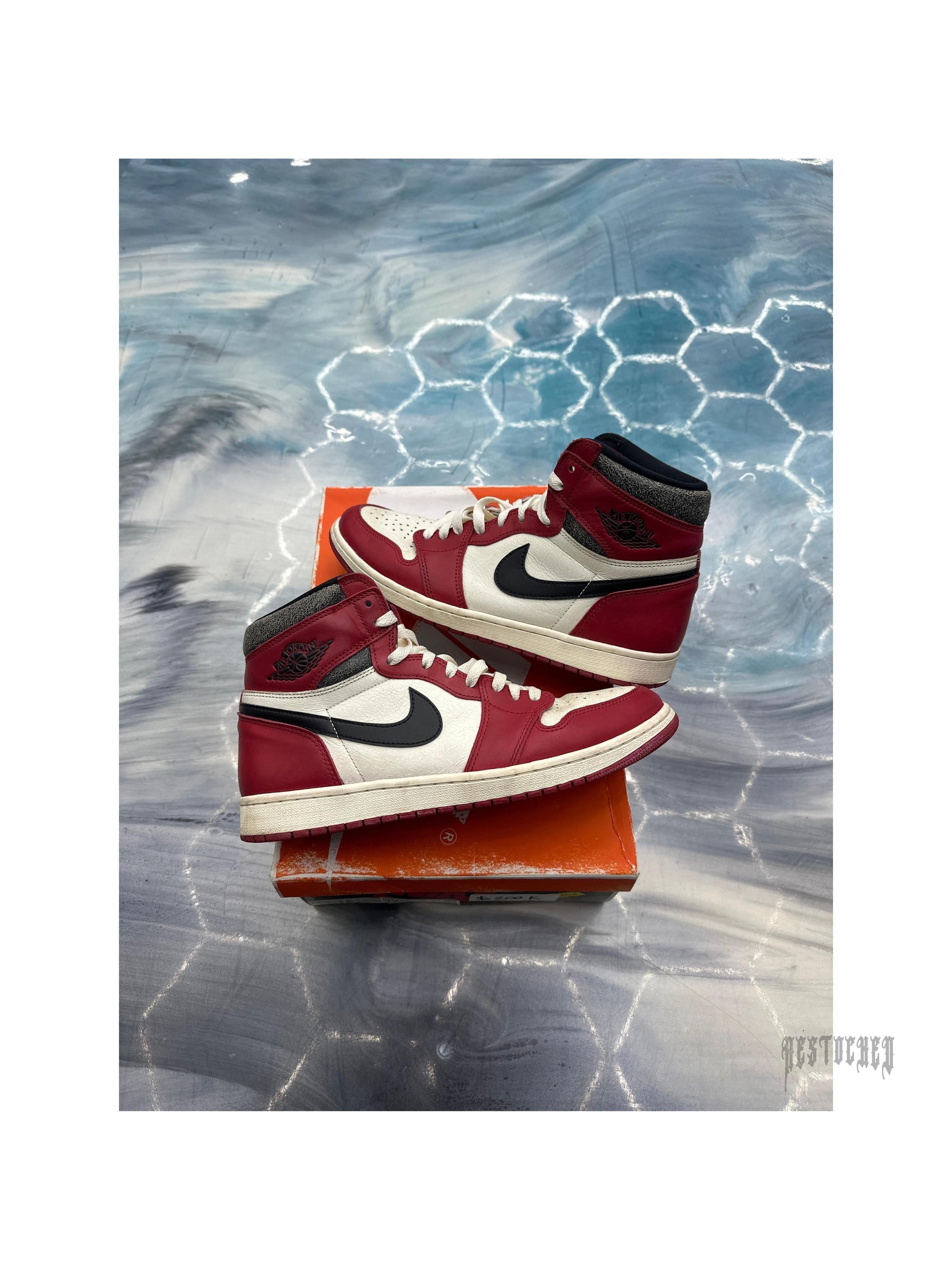 Pre-owned Jordan 1 Retro High OG Chicago Lost and Found sneakers, size 11, red, white, and black leather.