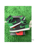 Pre-owned Jordan 1 Retro High Pine Green Black sneakers, size 10.5, on a box and green turf.
