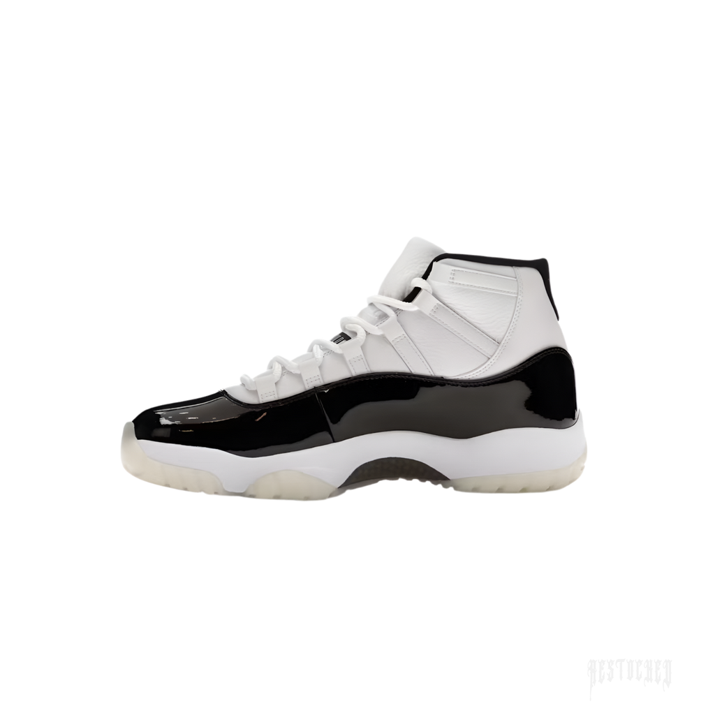 JORDAN 11 RETRO DMP GRATITUDE sneaker, white leather upper with black patent leather mudguard, translucent sole.
