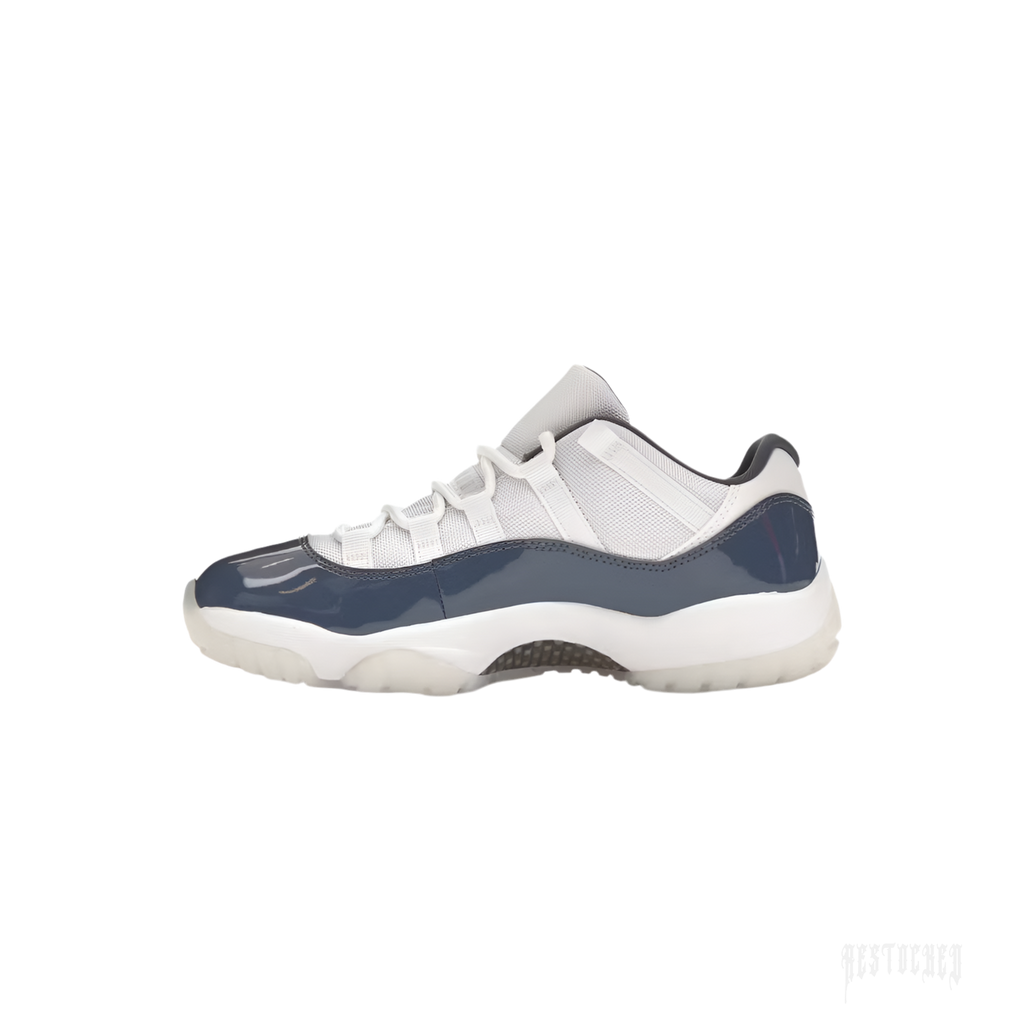 JORDAN 11 Retro Low Diffused Blue sneaker with white mesh upper and glossy navy mudguard.