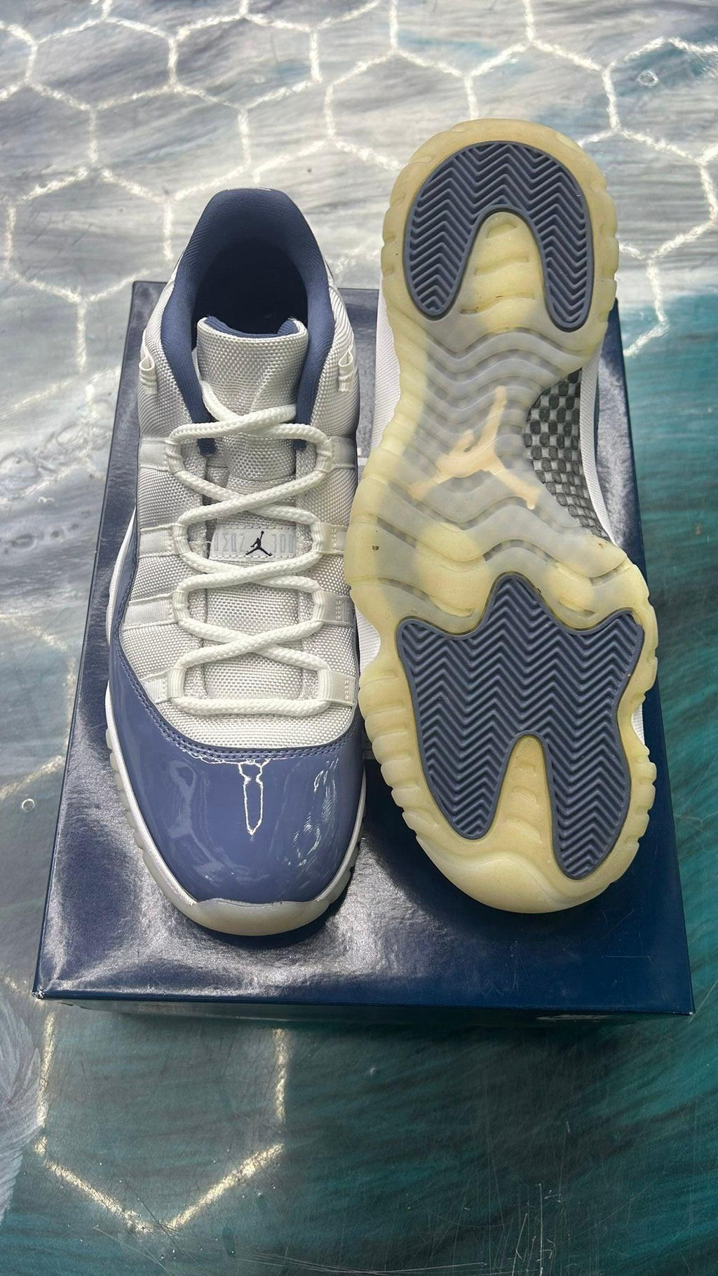 Pre-owned Jordan 11 Retro Low Diffused Blue size 11, light grey upper with blue patent leather and translucent sole.