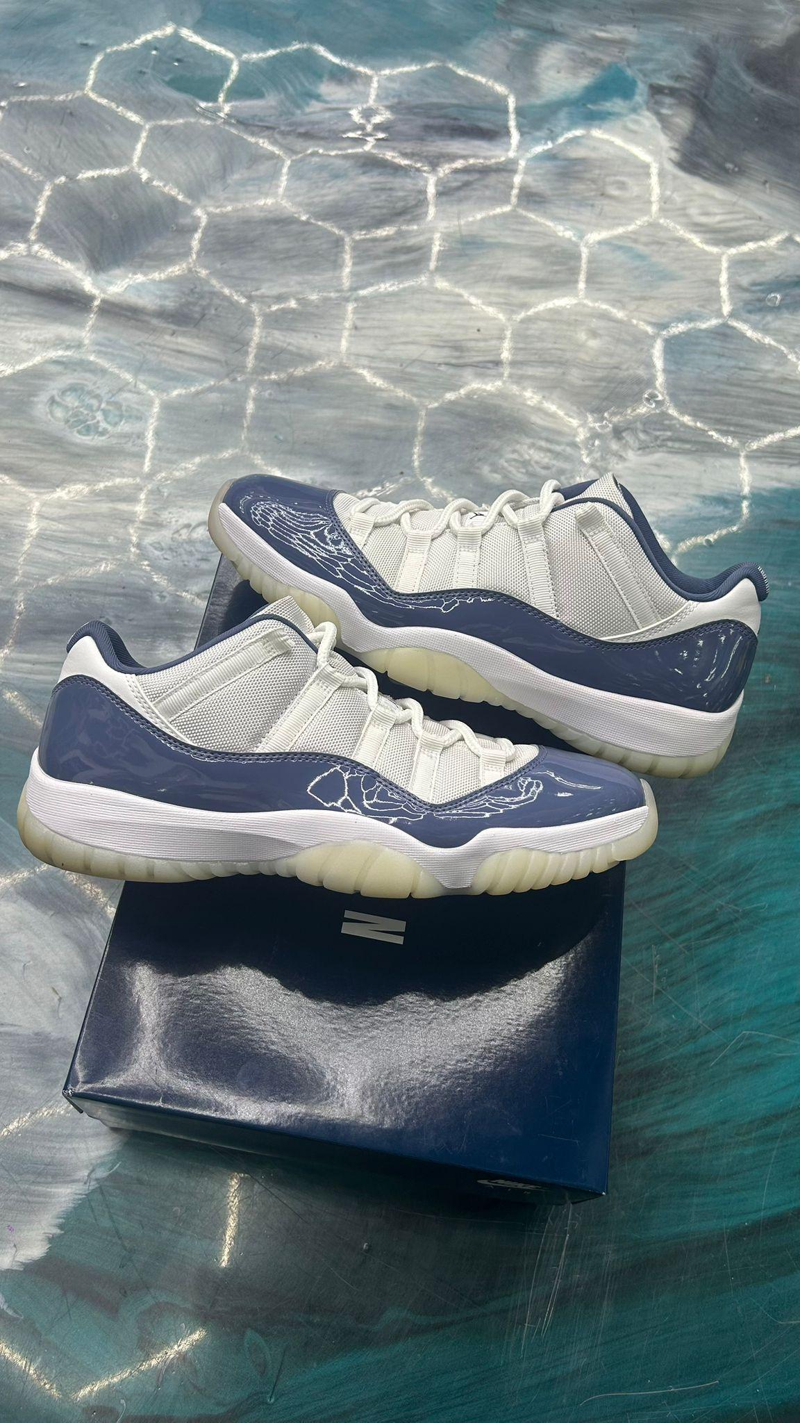 JORDAN 11 Retro Low Diffused Blue pre-owned size 11 sneakers with white mesh and blue patent leather.