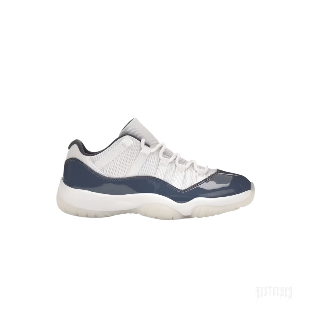 JORDAN 11 Retro Low Diffused Blue sneaker, side view, with white mesh upper and navy patent leather mudguard.