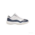 JORDAN 11 Retro Low Diffused Blue sneaker, side view, with white mesh upper and navy patent leather mudguard.