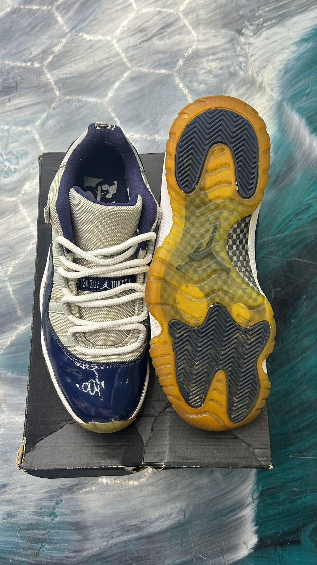 Pre-owned Jordan 11 Retro Low Georgetown, size 9.5, with navy patent leather and grey mesh upper, white laces, and a translucent yellow sole.