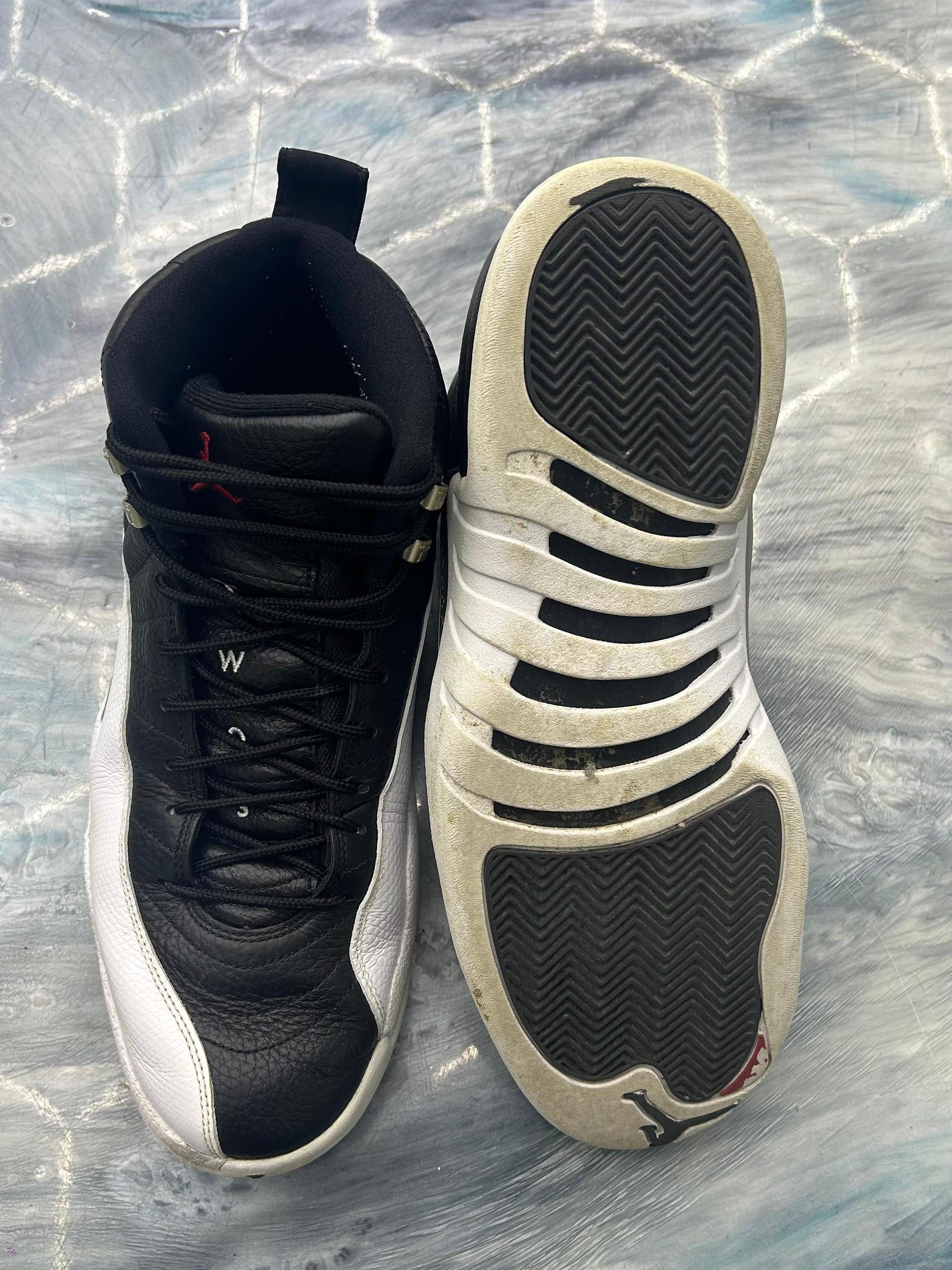 Pre-owned Jordan 12 Retro Playoff (2022) size 13, black leather upper, white mudguard, and worn white sole.