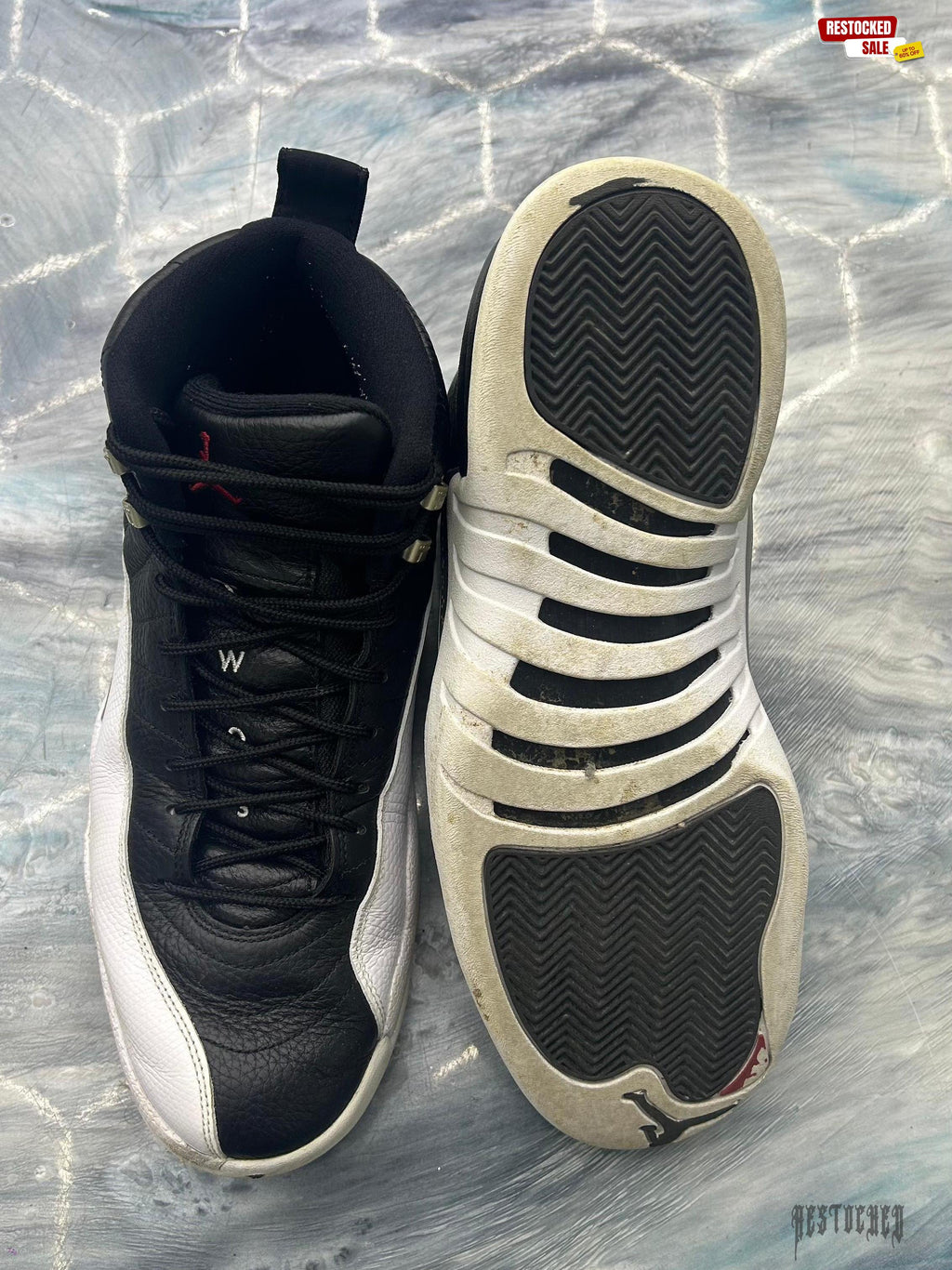Pre-owned Jordan 12 Retro Playoff (2022) size 13, black leather upper, white mudguard, and worn white sole.