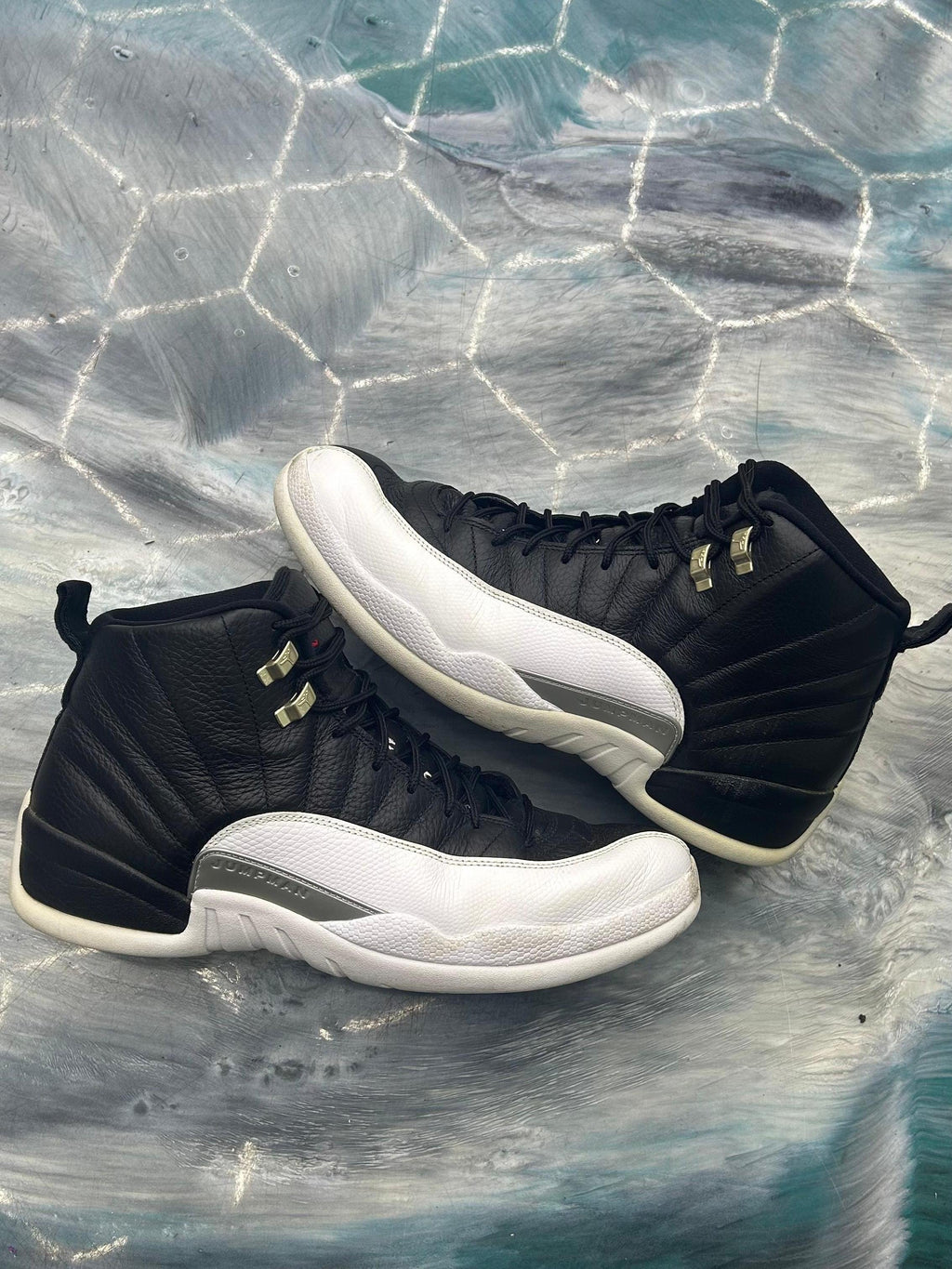 Pre-owned Jordan 12 Retro Playoff (2022) size 13 sneakers, black leather upper with white mudguard.