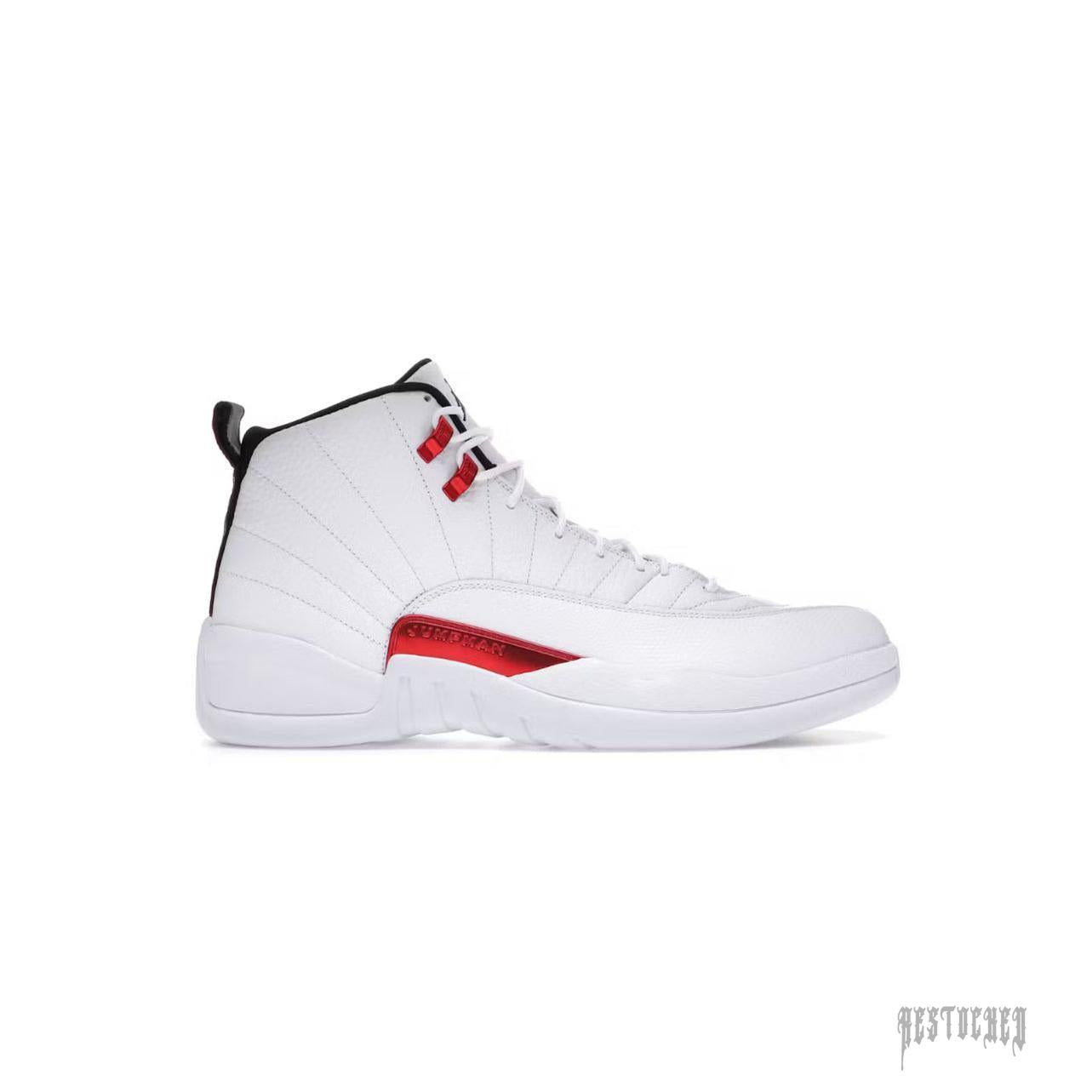 JORDAN 12 RETRO TWIST sneaker: White leather upper with red accents, black lining, and signature Jumpman branding.