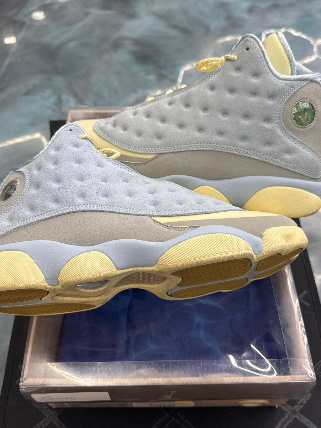 JORDAN 13 Retro SoleFly pre-owned size 11, light blue suede and tan leather with yellow soles.