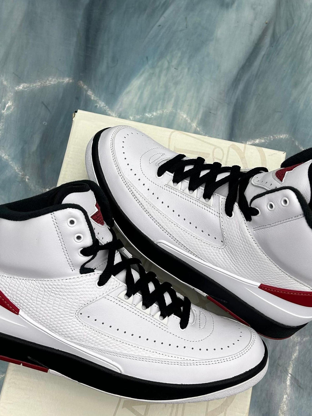 Pre-owned Jordan 2 Retro Chicago sneakers, white leather with black laces and red accents.