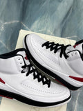 Pre-owned Jordan 2 Retro Chicago sneakers, white leather with black laces and red accents.
