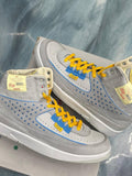JORDAN 2 RETRO SP UNION Grey Fog sneakers, size 10.5, with yellow laces and blue accents.