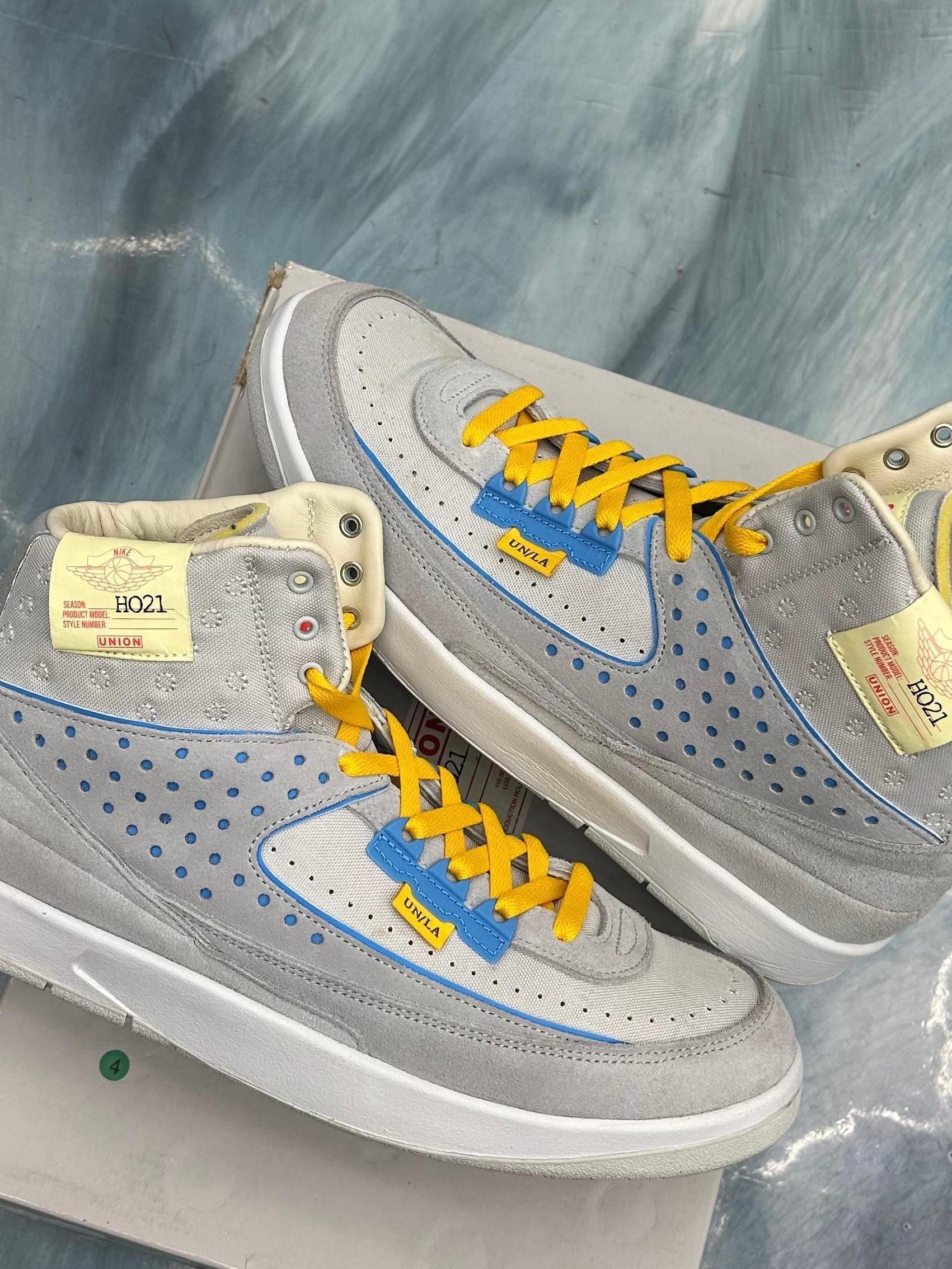 JORDAN 2 RETRO SP UNION Grey Fog sneakers, size 10.5, with yellow laces and blue accents.