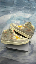 Pre-owned Jordan 2 Retro SP Union Ratan sneakers, size 11.5, with light grey suede, perforated sides, and yellow accents.