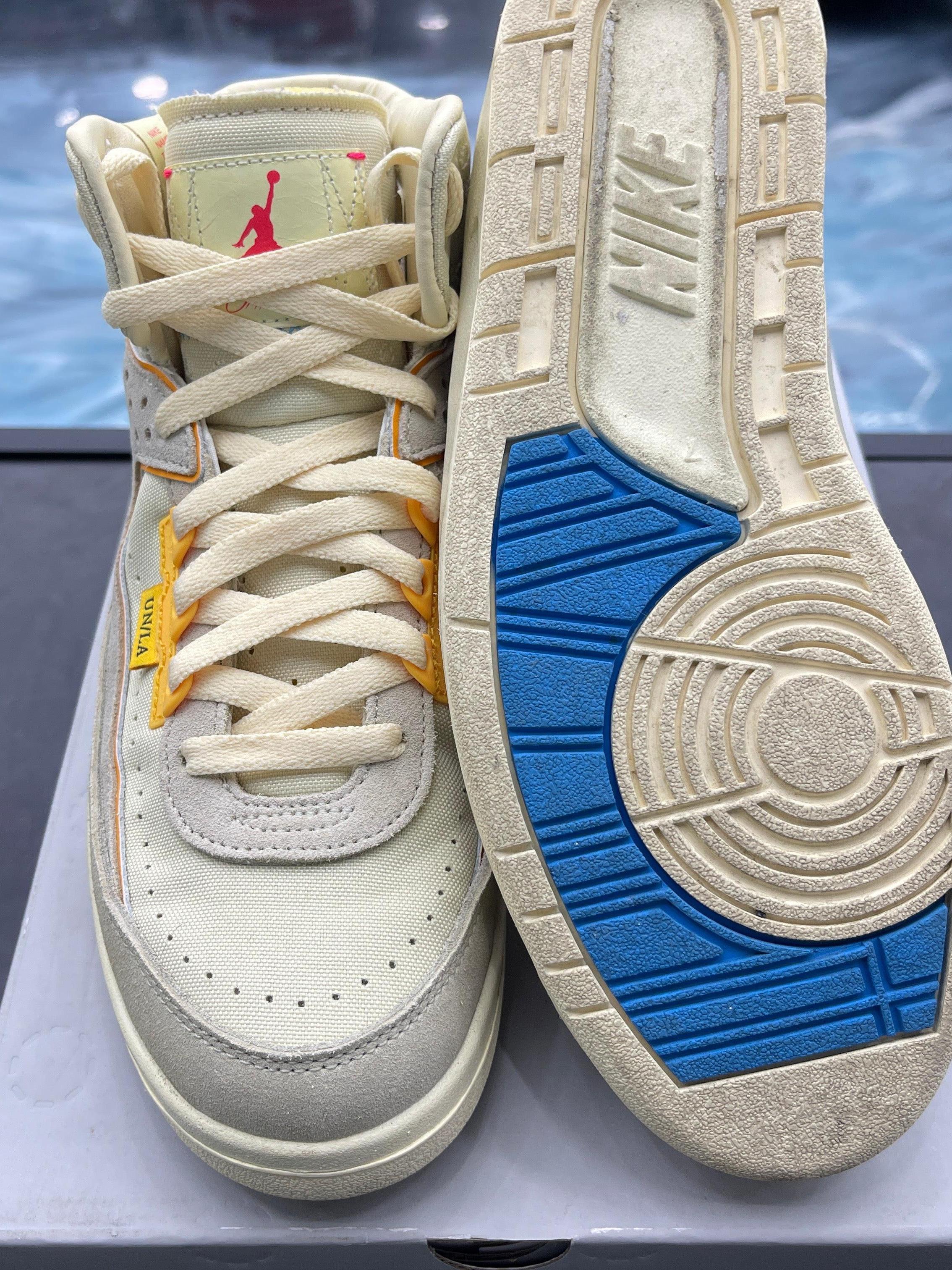 Pre-owned JORDAN 2 RETRO SP UNION RATTAN Size 7, showing cream upper with yellow accents and blue outsole.