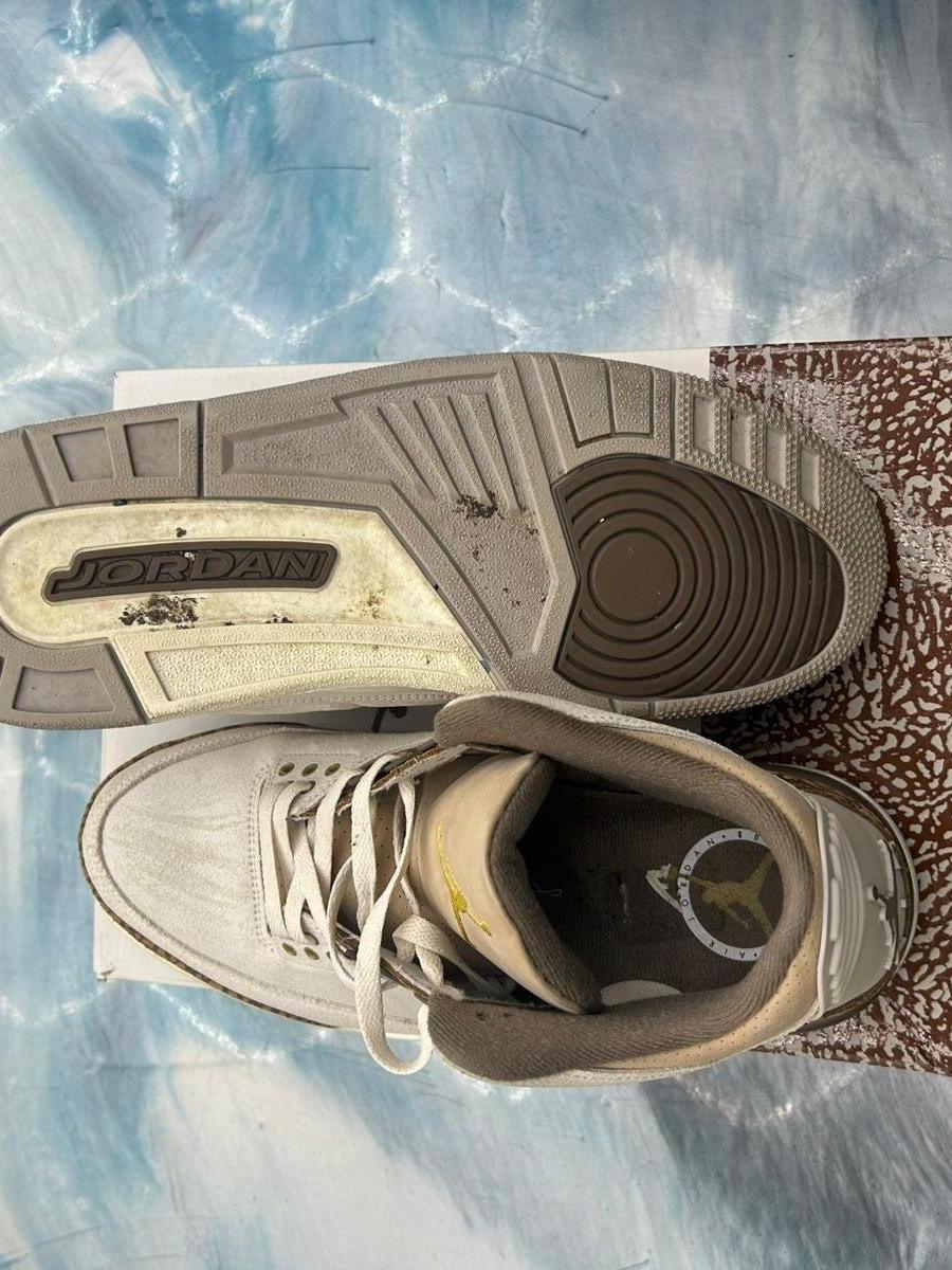 Pre-owned JORDAN 3 RETRO PALOMINO SIZE 12, top-down view showing tan and brown soles, light upper.