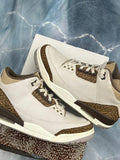 Pre-owned Jordan 3 Retro Palomino sneakers, size 9.5, in off-white with brown elephant print accents.