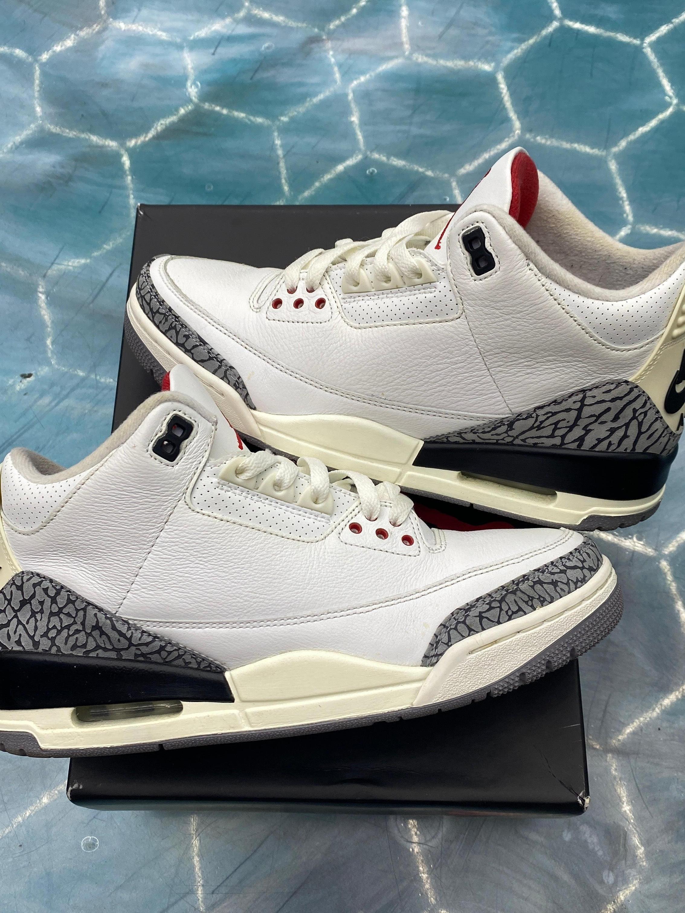 JORDAN 3 Retro White Cement Reimagined pre-owned size 9 sneakers with elephant print trim.