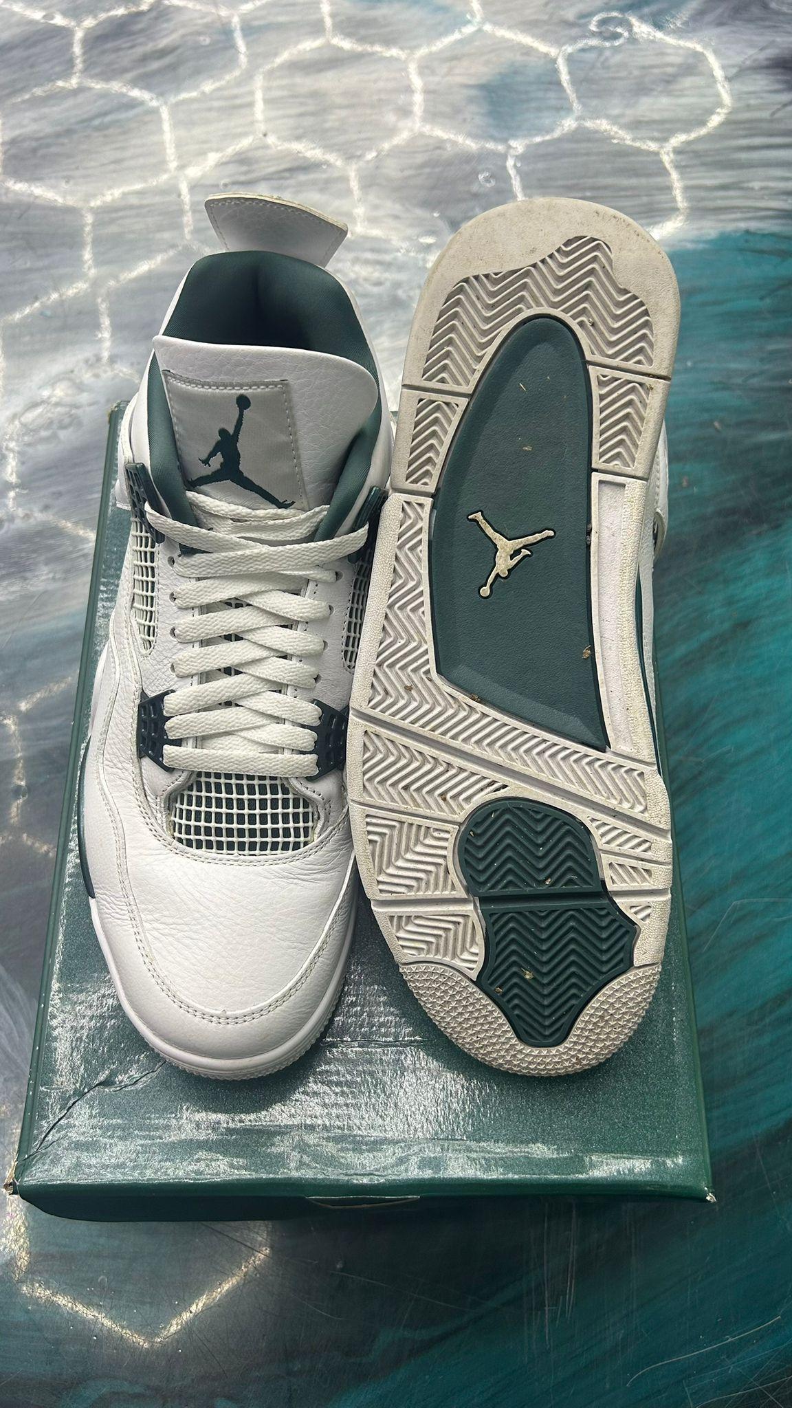 Pre-owned Jordan 4 Oxidized Green sneakers, size 11, showing white leather uppers and dark green accents.