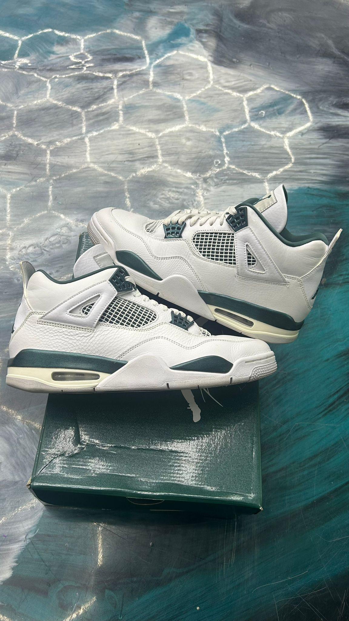 Pre-owned Jordan 4 Oxidized Green sneakers, size 11, with white leather uppers and dark green accents.