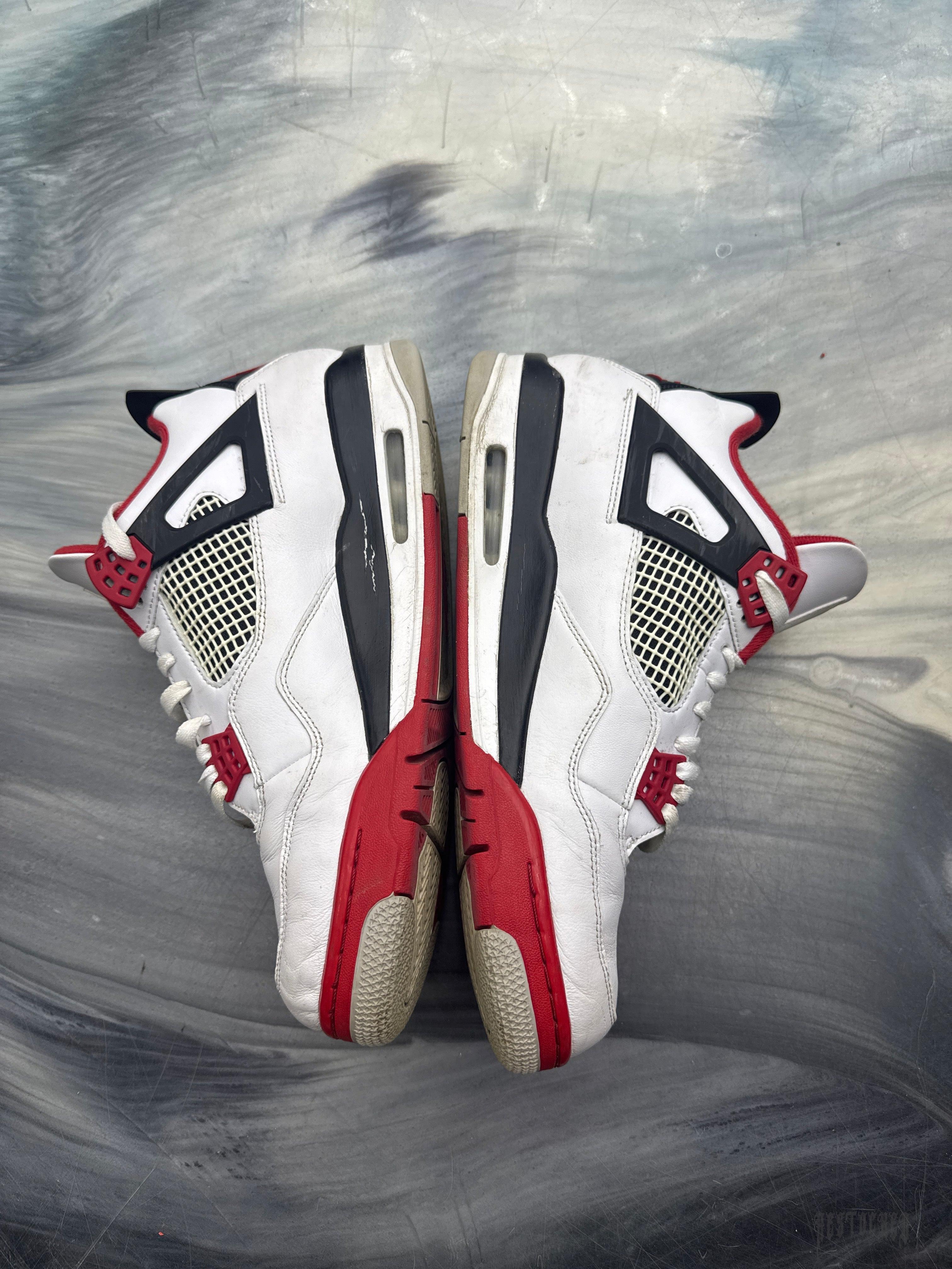 Pre-owned Jordan 4 Retro Fire Red sneakers, white leather with red and black accents, size 12.
