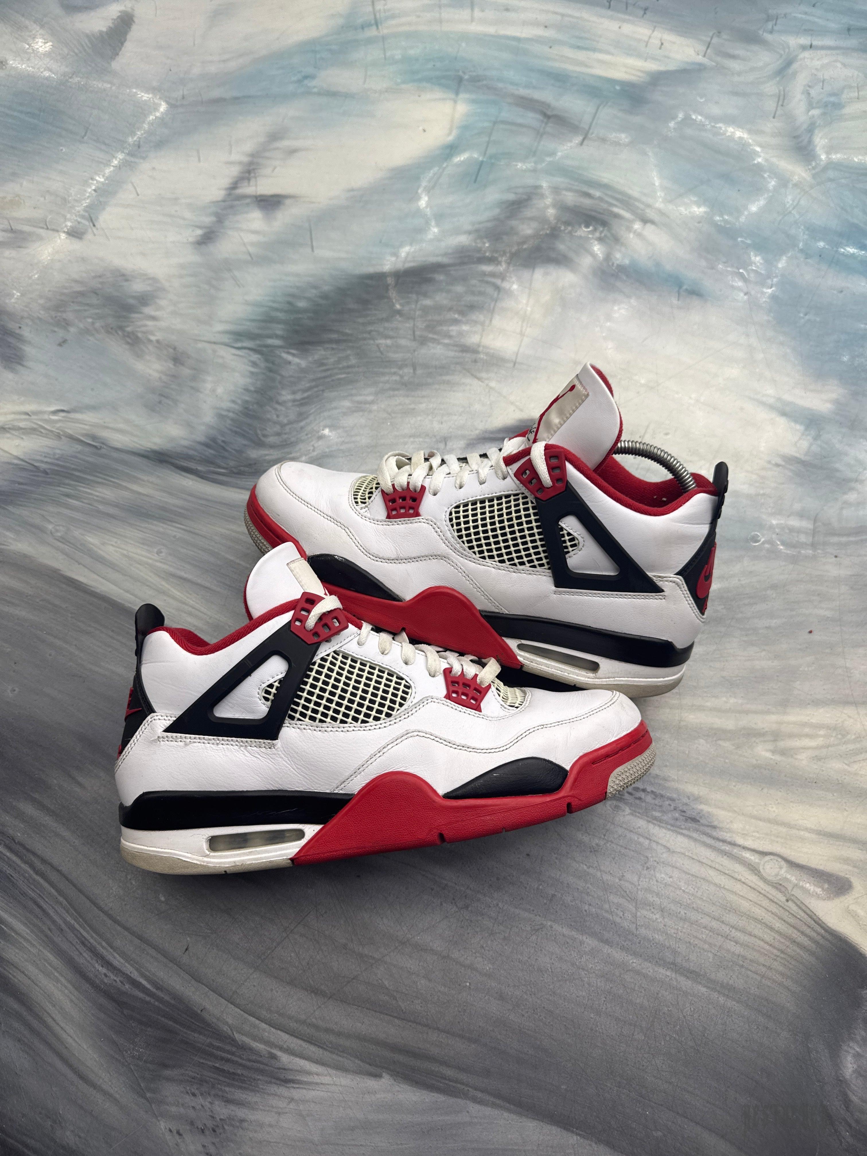 Pre-owned Jordan 4 Retro Fire Red sneakers, white leather with red and black accents, size 12.