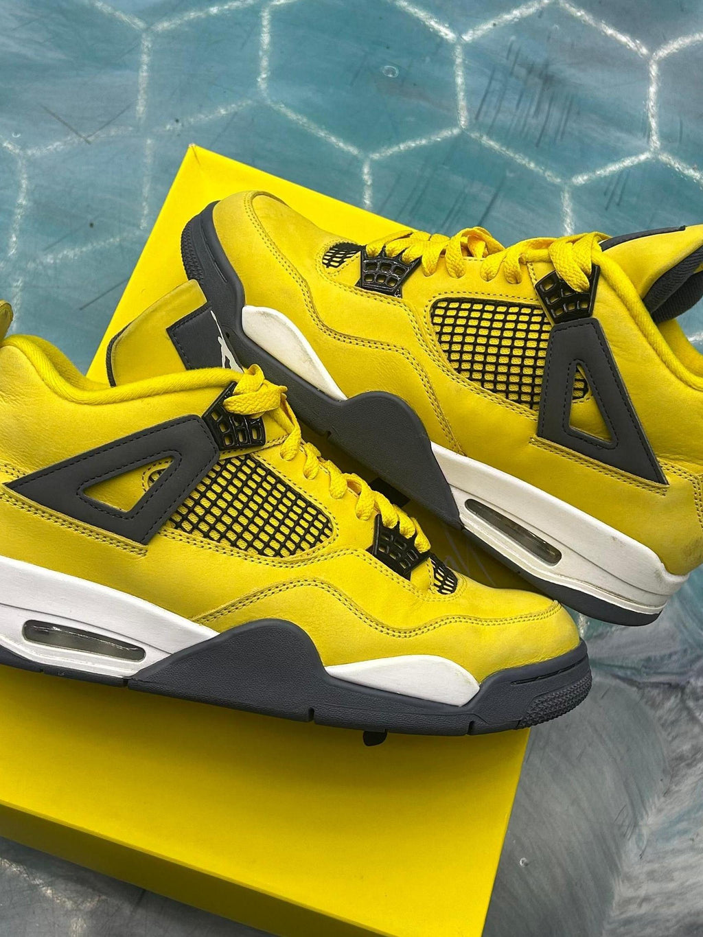 Pre-owned JORDAN 4 RETRO LIGHTNING sneakers, size 10, in vibrant yellow nubuck with dark grey accents.