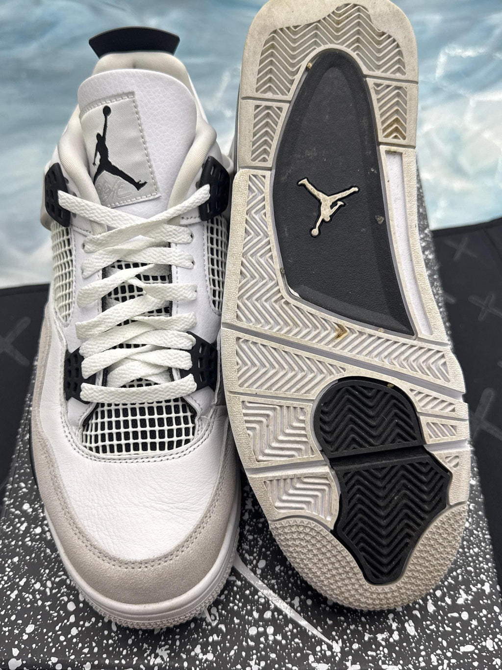 Pre-owned Jordan 4 Retro Military Black sneakers, size 10, showing white leather upper, black accents, and sole.