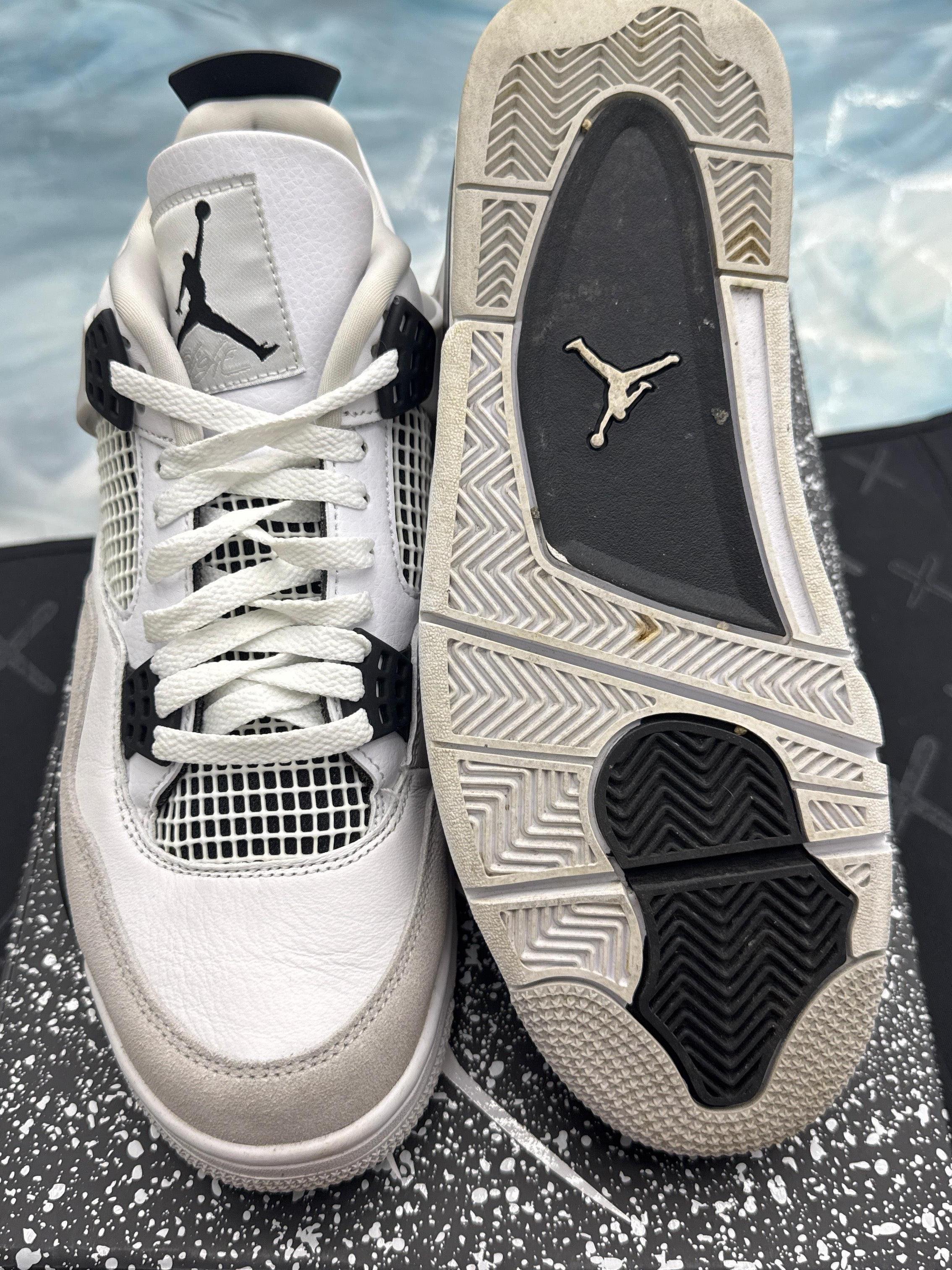 Pre-owned Jordan 4 Retro Military Black sneakers, size 10, showing white leather upper, black accents, and sole.