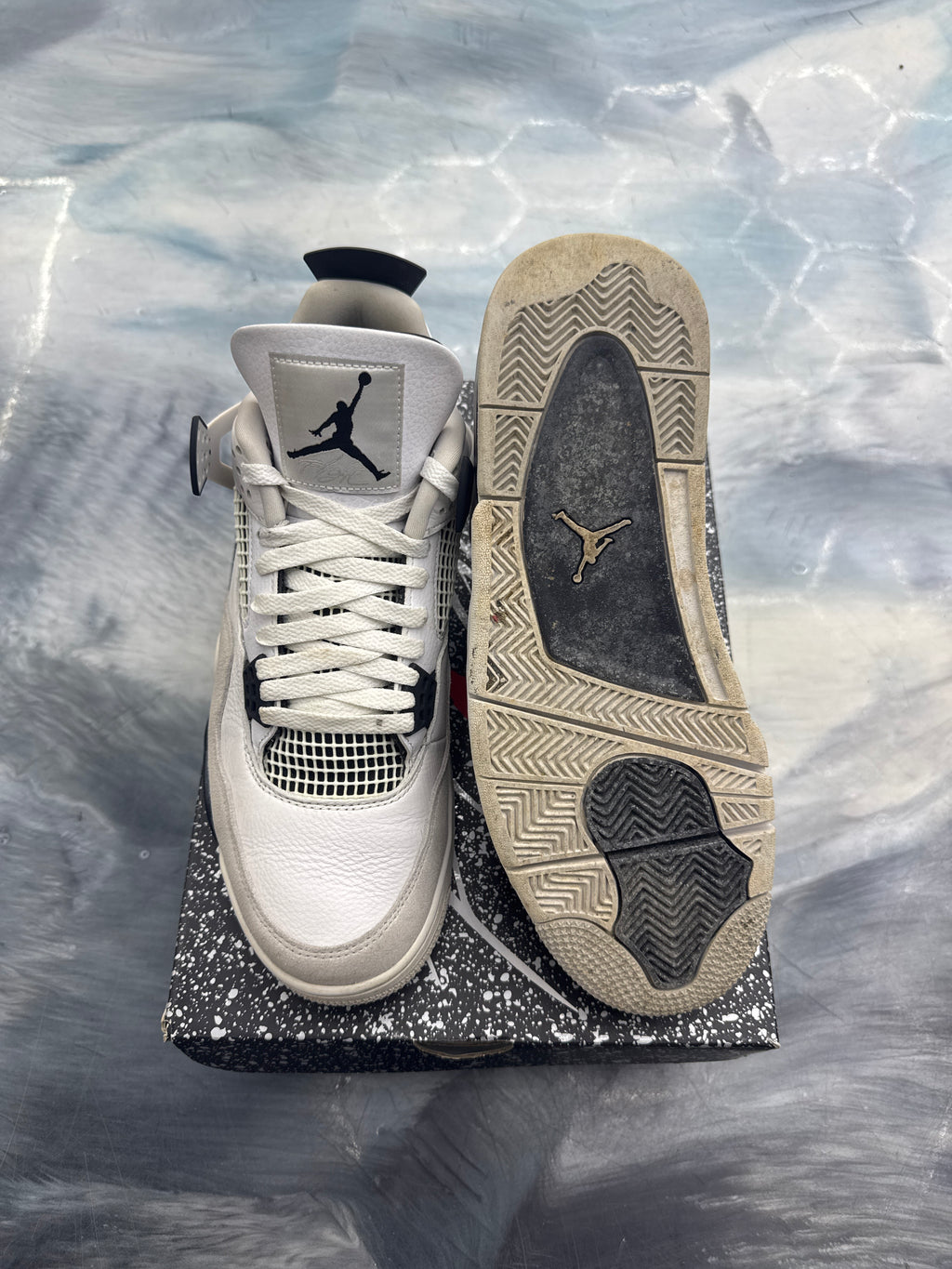 Pre-owned Jordan 4 Retro Military Black sneakers, white leather with black accents, size 11, showing worn sole.