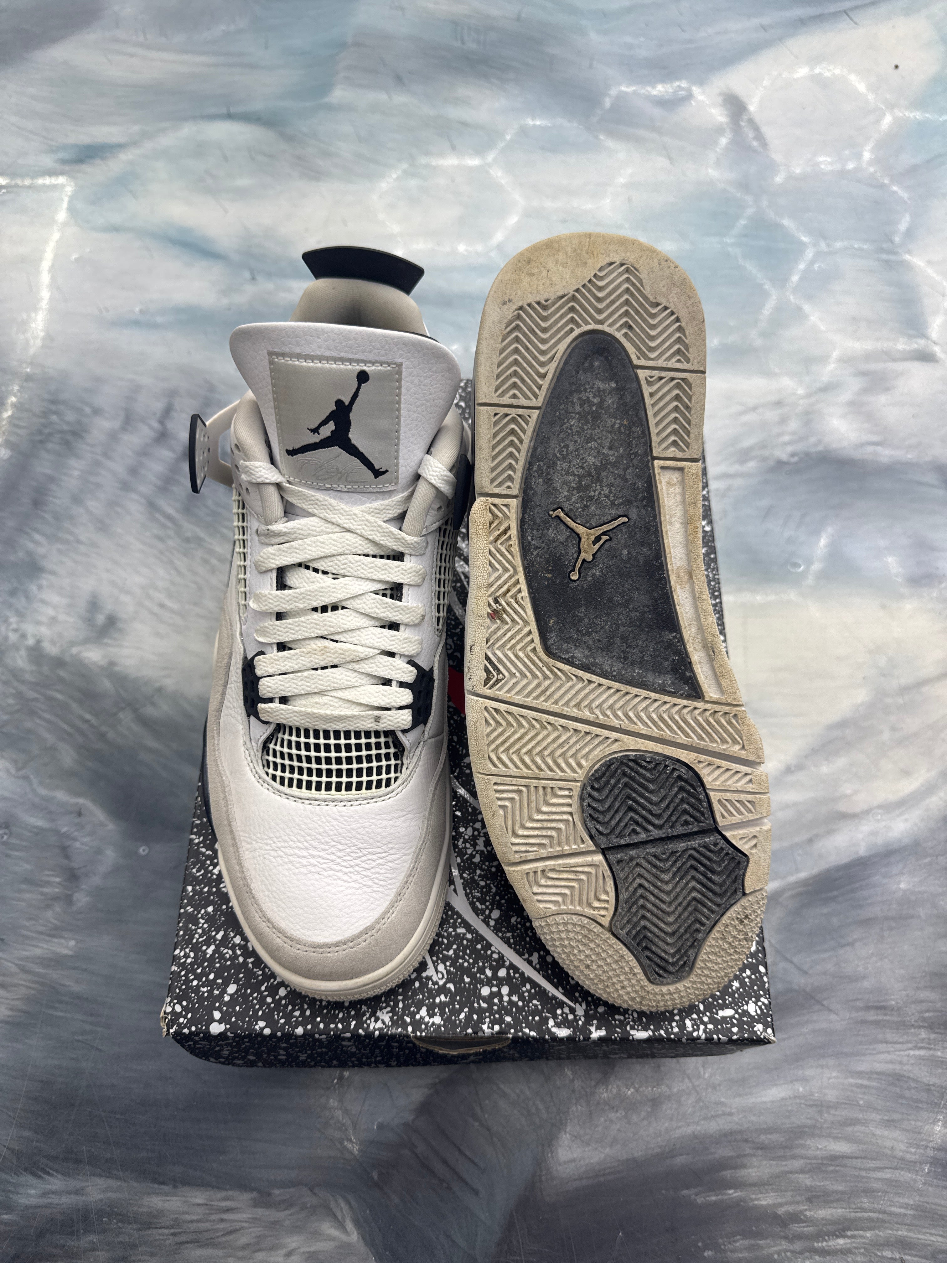 Pre-owned Jordan 4 Retro Military Black sneakers, white leather with black accents, size 11, showing worn sole.