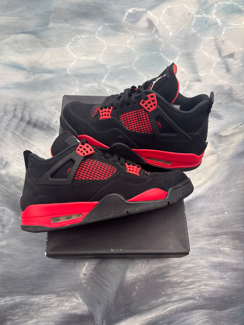 Pre-owned Jordan 4 Retro Red Thunder sneakers, black suede with red accents, size 11.