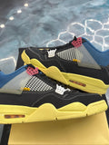 JORDAN 4 Retro Union Off Noir pre-owned size 10.5 sneakers with black suede, blue collar, yellow sole, and white mesh.
