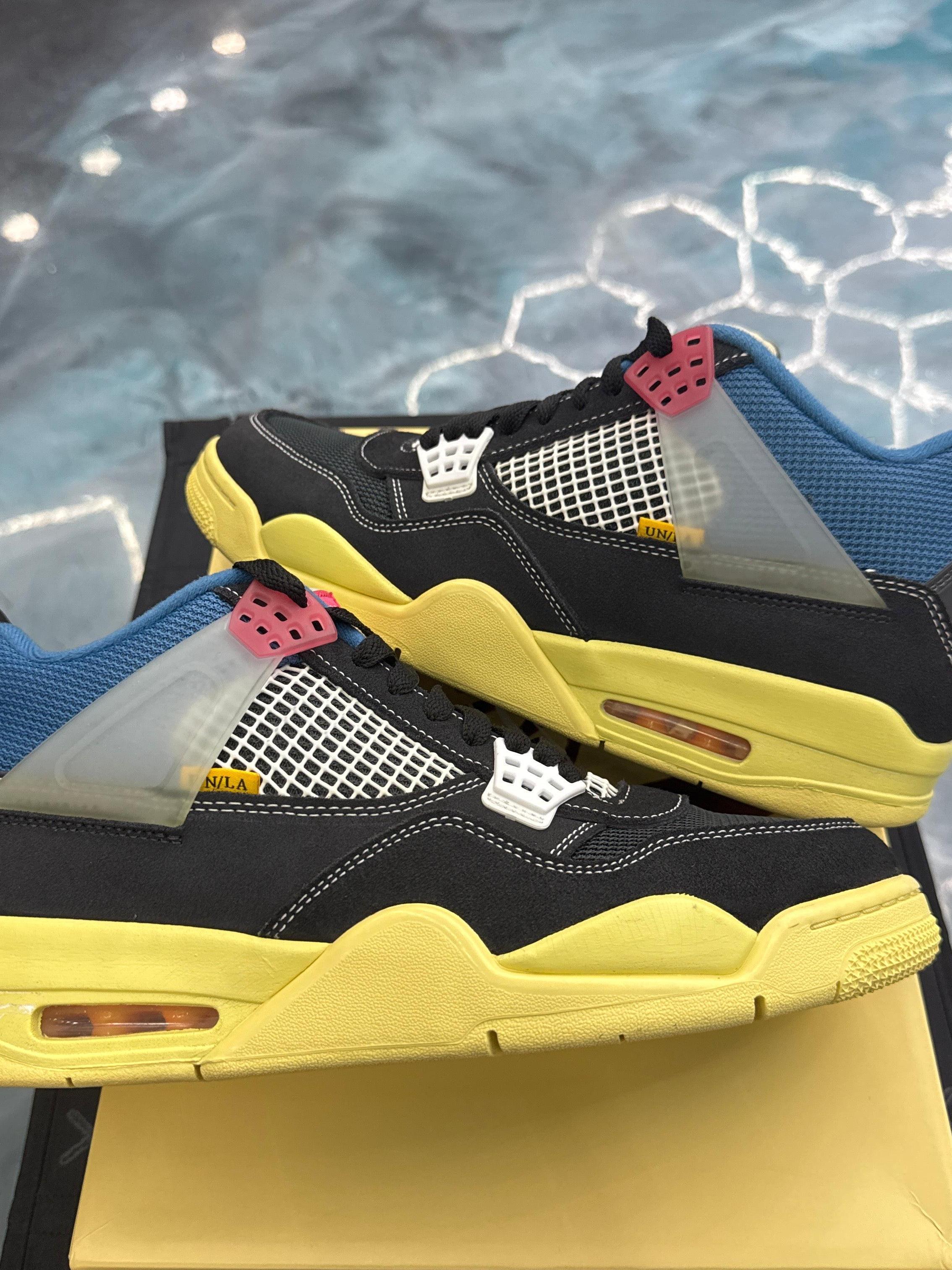 JORDAN 4 Retro Union Off Noir pre-owned size 10.5 sneakers with black suede, blue collar, yellow sole, and white mesh.