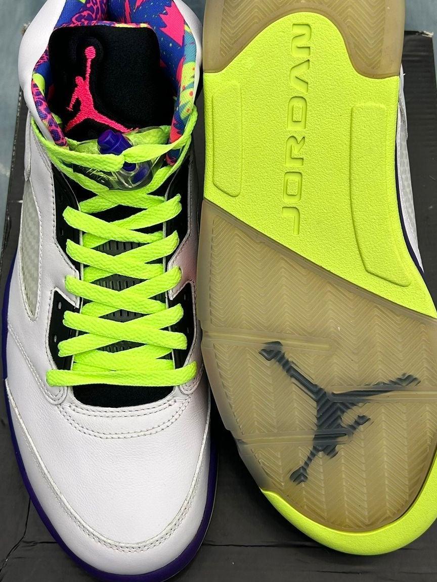 White Jordan 5 Retro Bell Air sneakers, size 11, with neon yellow laces and sole, colorful lining.
