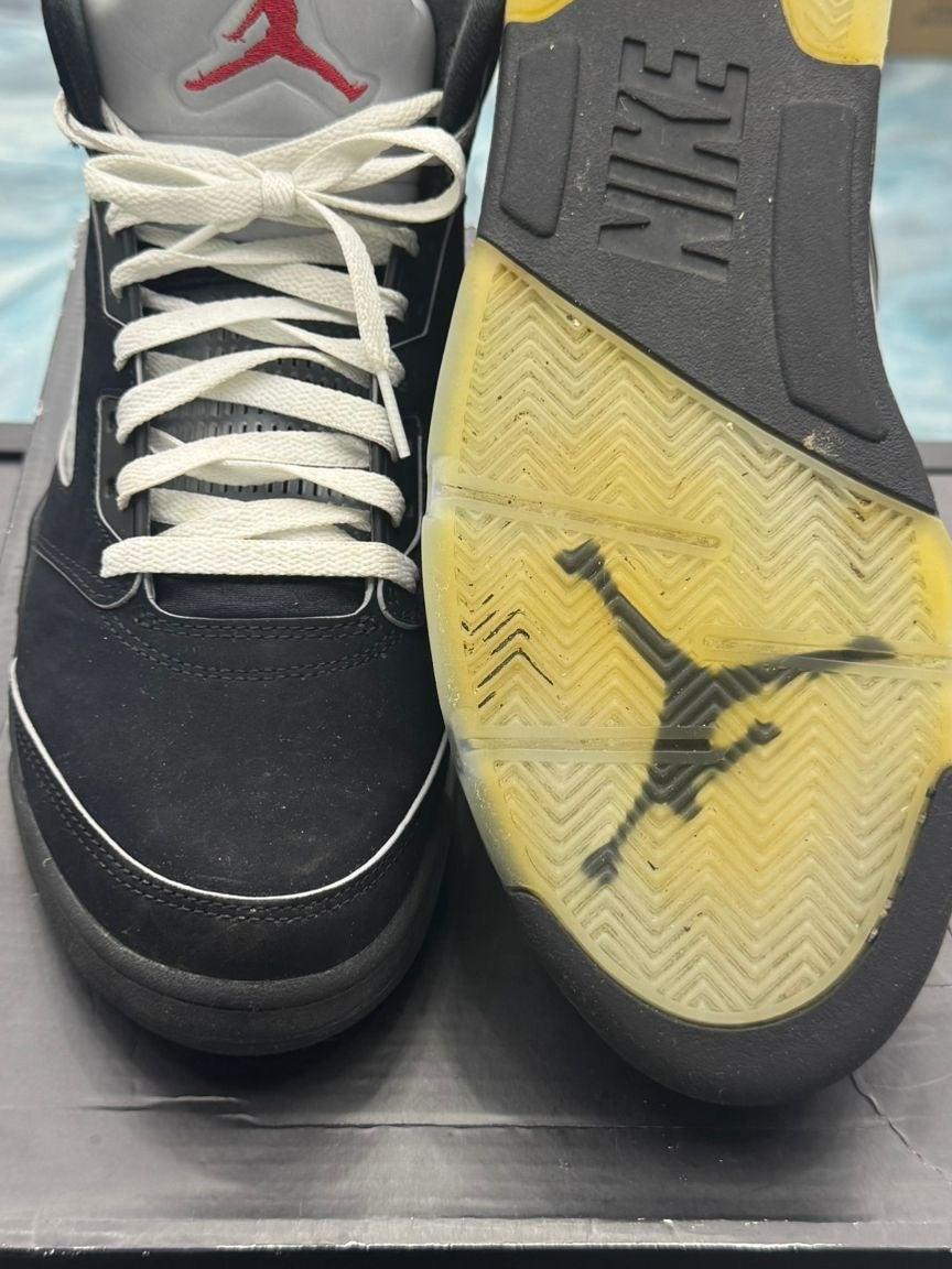 Pre-owned Jordan 5 Retro Black Metallic Reimagined size 9.5, showing black nubuck upper, white laces, and yellowed translucent sole with black Jumpman.