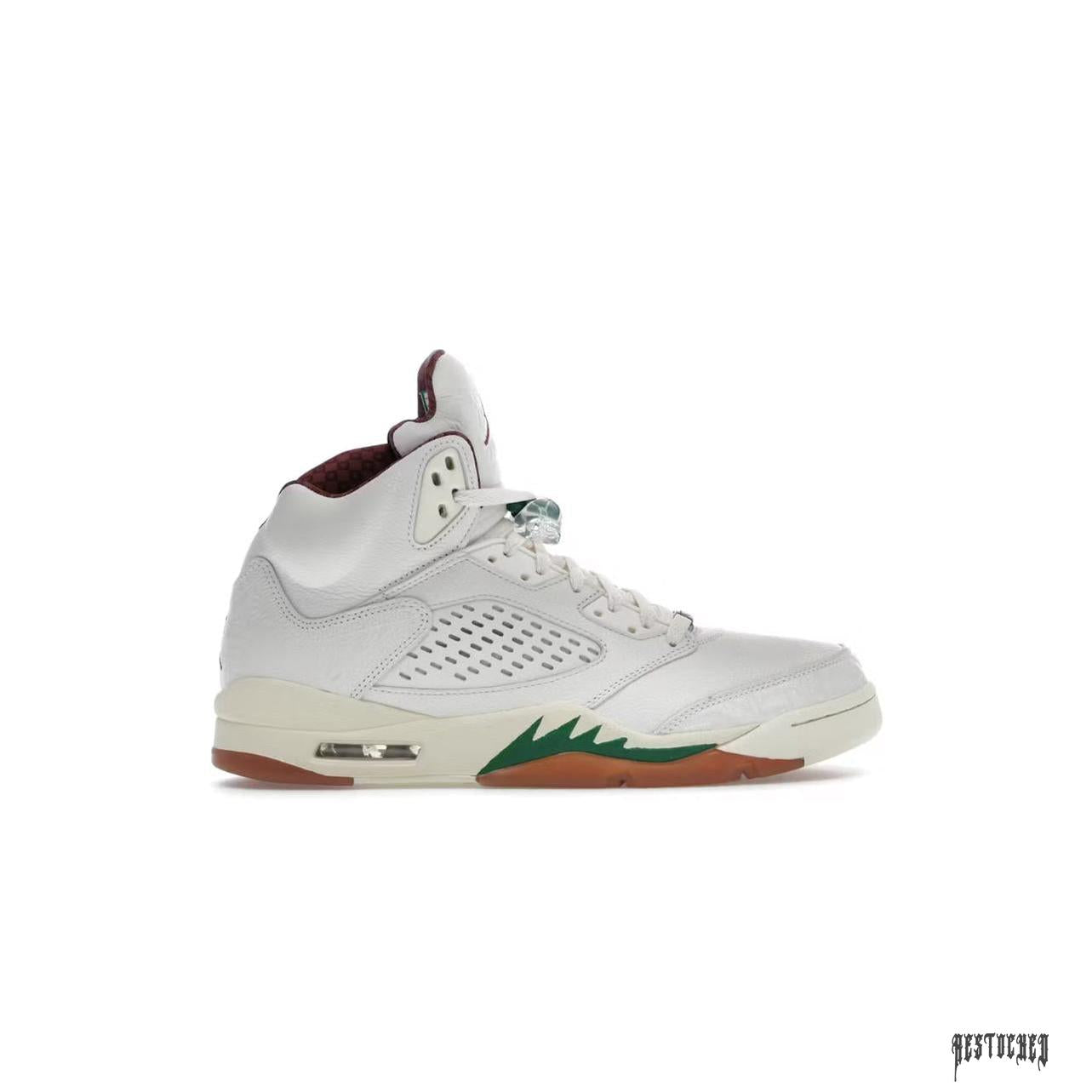 Jordan 5 Retro El Grito Sail sneaker, white leather upper, green shark teeth, red accents, and gum sole.