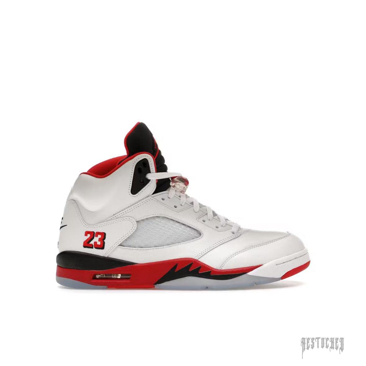 Jordan 5 Retro Fire Red with white leather, black tongue, red midsole, and "23" on the heel.