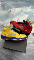 Pre-owned Jordan 5 Retro "What The" size 11, featuring mismatched red and yellow suede uppers with vibrant accents.