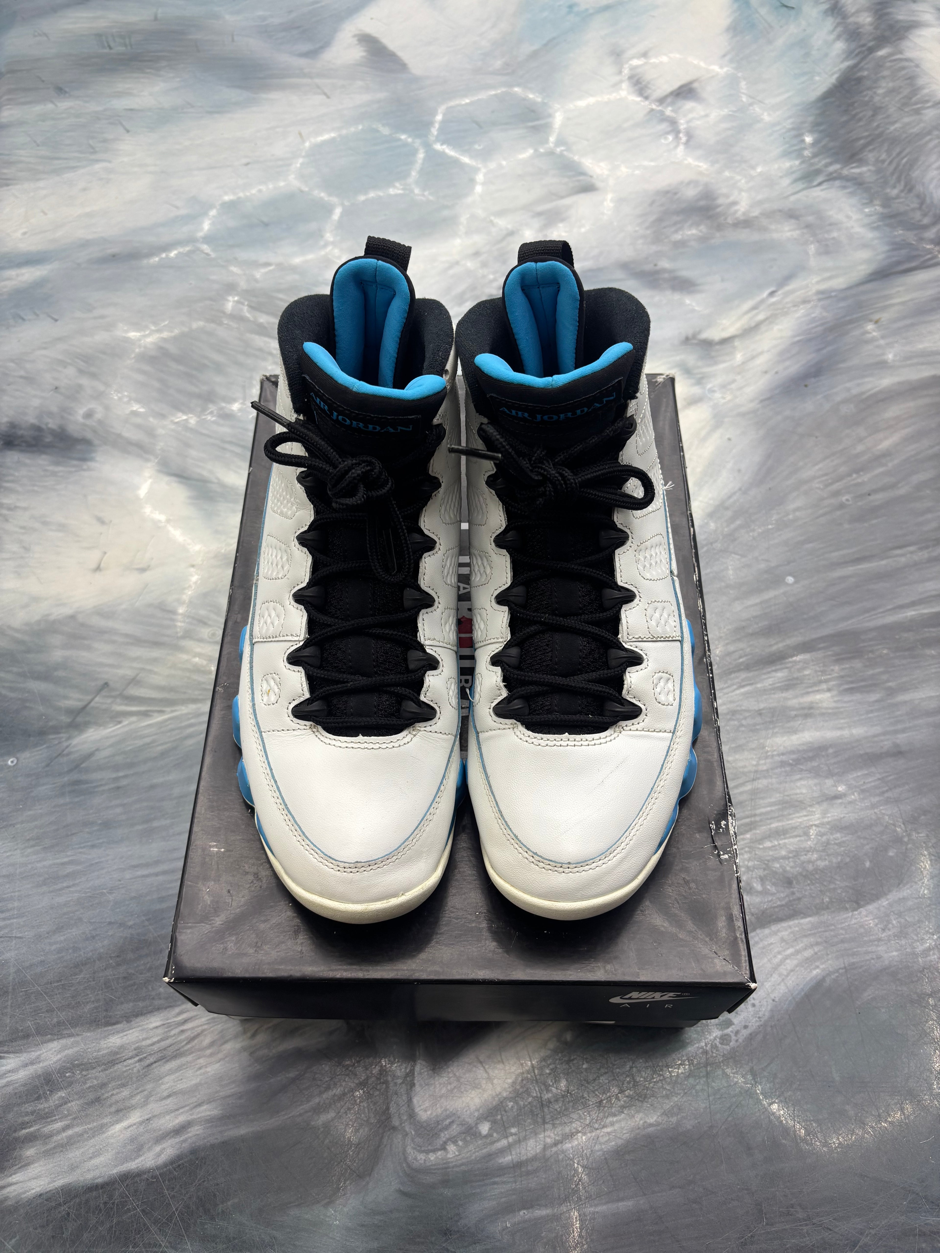 Pre-owned Jordan 9 Retro Powder Blue sneakers, white leather with black laces and blue accents, size 8.