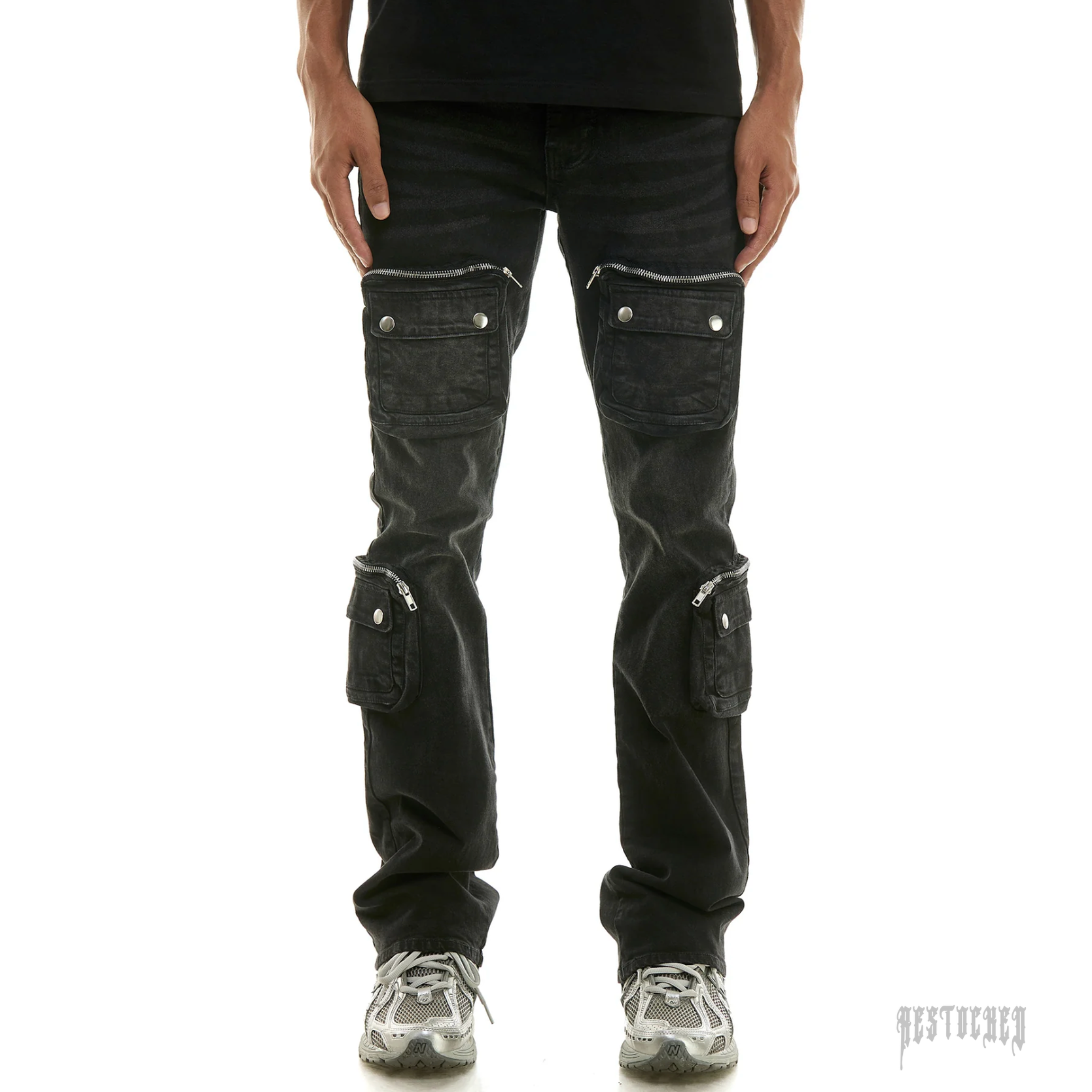 KDNK black 3D cargo flare jeans with multiple zippered pockets and silver hardware.