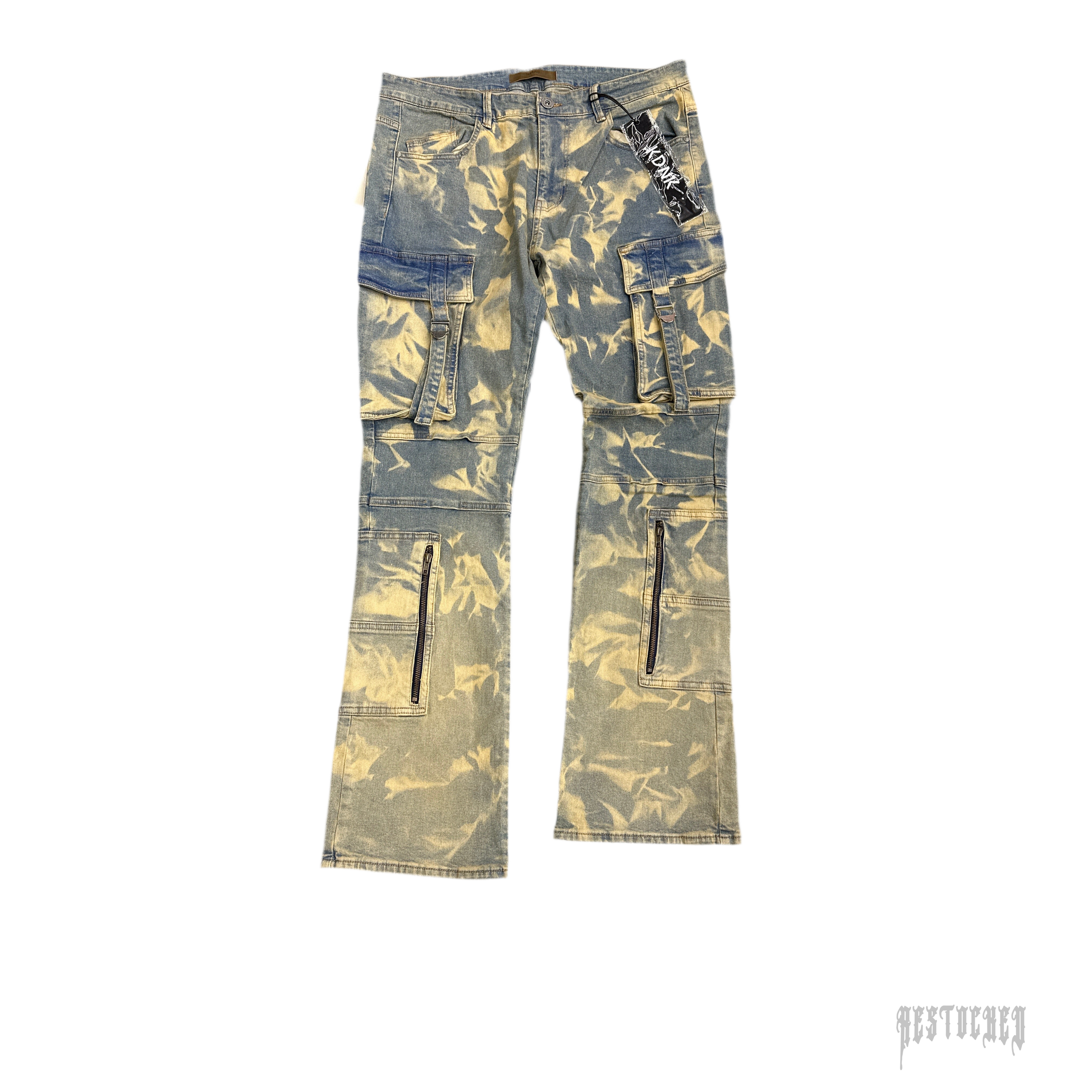 KDNK bleached cargo jeans with large side pockets, zip details, and a flared leg.