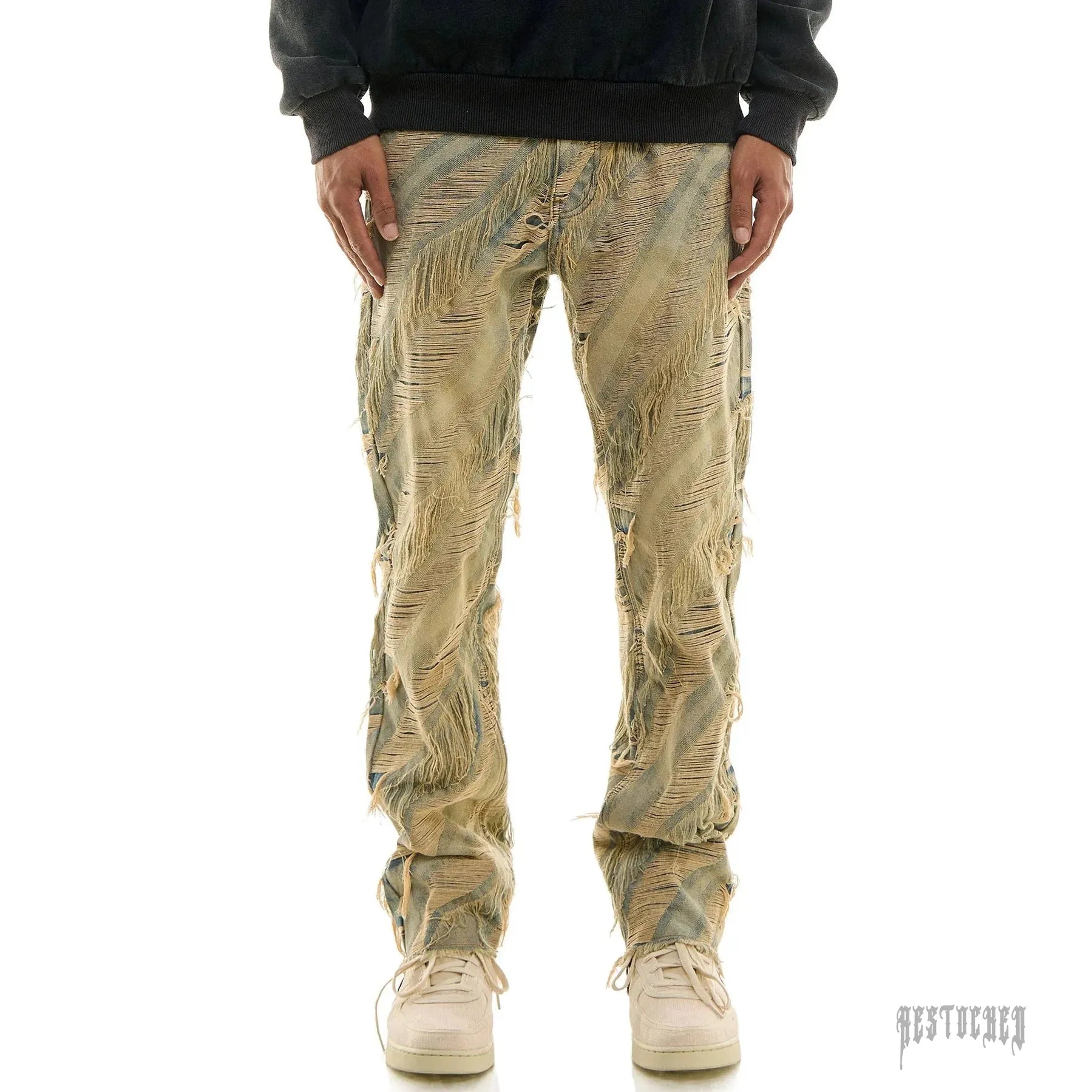KDNK LEVE SLIM JEANS KND4704, light wash distressed denim with extensive rips and frayed details.
