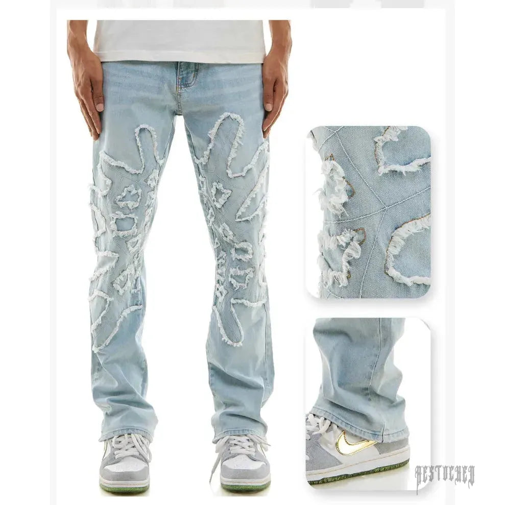 Light wash KDNK SPIDER WEB SLIM KND4712 jeans with distressed spider web cutouts and frayed edges.
